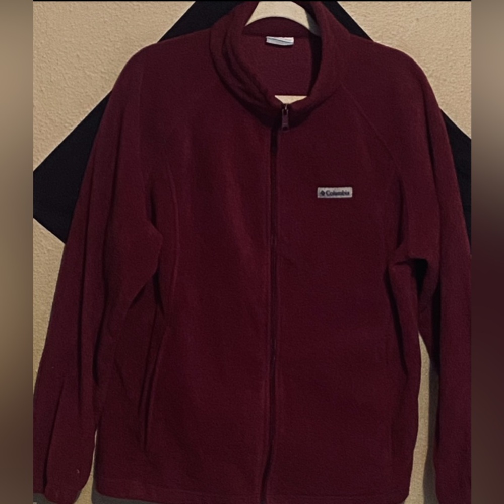Crafted with cozy, plush fleece, zippered pockets, and a cold-blocking collar.